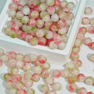 10mm translucent DIY glass beads with red and green floral patterns in a white tray