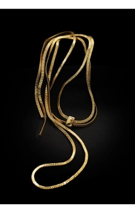 Close-up of golden flat snake chain with polished rectangular adjustable slider buckle