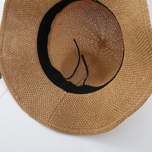 Detailed top view of breathable woven straw hat featuring black sweatband and adjustable drawstring