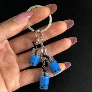 Detail of blue bubble tea keychain with mini resin charms and silver metal chain