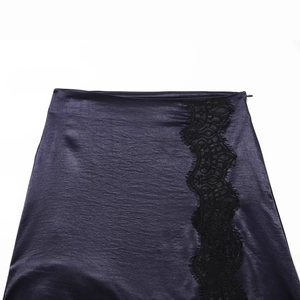 Elegant deep purple satin mini skirt featuring delicate black lace patchwork detail