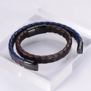 Detail of multi-layer woven leather bracelet with blue-brown patterns and magnetic clasp