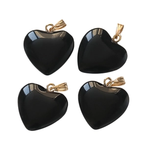Polished black heart-shaped acrylic charms with golden metal clasp in a 4-piece set