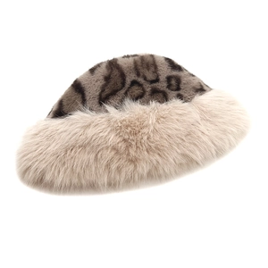 Close-up of leopard print faux fur texture and thick plush brim on a winter bucket hat