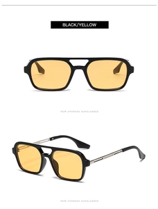 Detail view of double bridge sunglasses with black frames and yellow tinted lenses