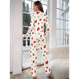 Women's two-piece heart print pajama set with long sleeves and pants in white and red