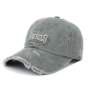 Close-up of 3D embroidered ANGELS logo and distressed frayed brim on a grey baseball cap