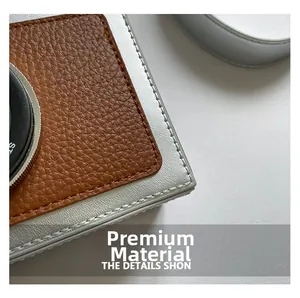 Close-up of vintage camera bag with brown lychee leather and silver metallic details