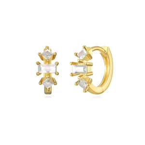 Detailed macro view of gold hoop earrings featuring geometric square white zircons