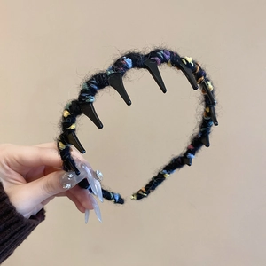 Close-up of a multi-color knit wavy headband with anti-slip inner teeth for hair