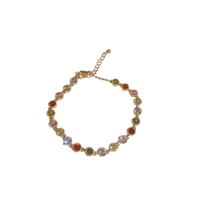 Gold plated bracelet featuring multi-colored round zircons and adjustable lobster clasp