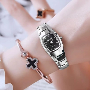 Close-up of a silver tonneau quartz watch with a black dial and rhinestone markers