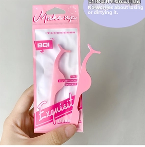 Pink ergonomic eyelash applicator tweezers with BQI packaging shown in hand