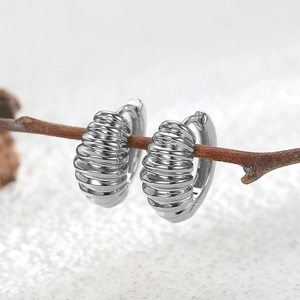 Silver geometric croissant hoop earrings with textured finish for a vintage look