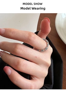 Close-up of S925 sterling silver ring with colorful rainbow cubic zirconia on finger