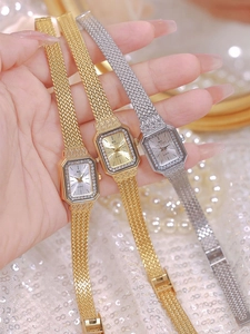 Close-up of BS Bee Sister square dial watches in gold and silver with crystal bezel