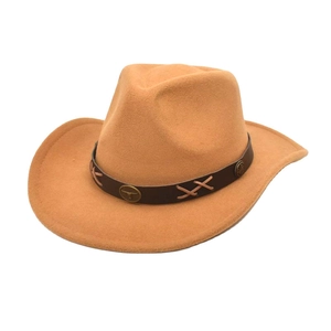 Close-up of vintage metal bull head buckle and cross stitching on leather hat band