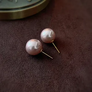 Elegant French-style gold needle pink pearl stud earrings with polished mirror finish