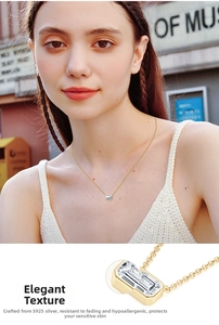 Close-up of S925 sterling silver emerald cut cubic zirconia pendant with model wearing it