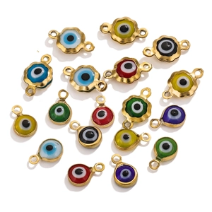 Macro detail of 6mm gold plated evil eye charms in assorted enamel colors for DIY jewelry