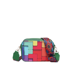 Colorful geometric block camera bag with patterned wide strap and green trim