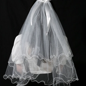 Elegant white dual-layer glowing wedding veil with bow decoration on a black background
