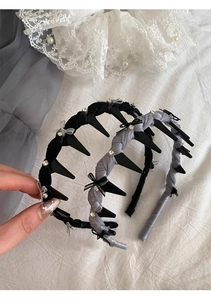 Detail of ballet style bow headband with rhinestones and non-slip inner teeth