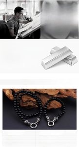 Detail of punk style black glass bead bracelet with stainless steel skull charms