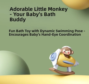 Close-up of baby bath toy featuring a cartoon monkey piloting a yellow plastic airplane