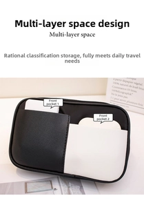 Detail view of black and white sports waist bag with dual front pockets for phone and earbuds
