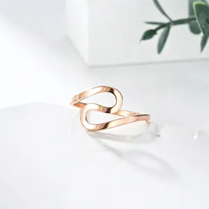 Minimalist S-shaped curved stainless steel ring in rose gold finish for women