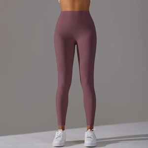 Detailed side view of high-waisted yoga pants in dusty rose featuring a butt-lifting effect