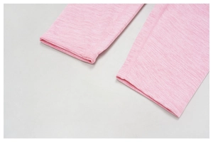 Close-up of pink marl high-waisted yoga leggings showing detail of the ankle seam and texture