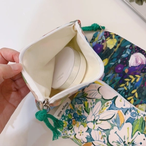 Floral canvas mini storage pouch with zipper and green woven lanyard for cosmetics