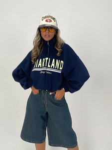 Oversized navy quarter-zip sweatshirt with vintage letter print and loose-fit blue denim jeans