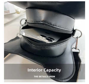 Detail view of guitar shaped crossbody bag interior showing phone storage capacity
