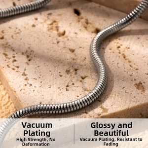 Macro detail of high-quality stainless steel snake chain with polished vacuum plating finish