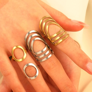 Set of four minimalist geometric stainless steel open rings in gold and silver finish