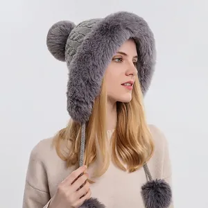 Women's gray cable knit winter hat with three pom-poms and warm faux fur lining