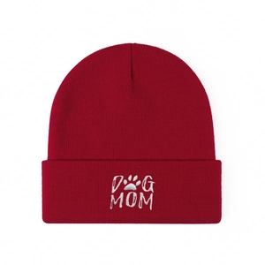 Burgundy knit beanie featuring DOG MOM embroidery and paw print on a plain white background