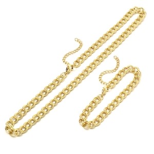 Golden stainless steel curb chain necklace and bracelet jewelry set on white background