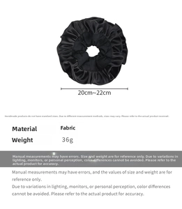 Detail of black double-layered satin scrunchie with ruffled edges and size dimensions