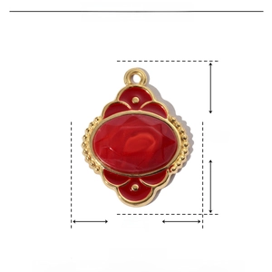 Detail view of red enamel Tree of Life pendant with dimensions 24mm by 18mm