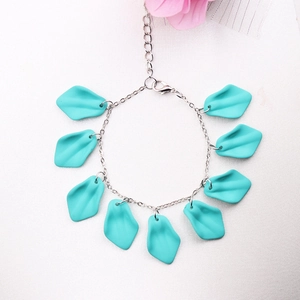 Detail view of silver chain bracelet with turquoise petal charms and adjustable clasp