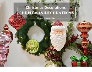 Close-up of vibrant painted Christmas baubles with nutcracker motifs and glossy gift box charms
