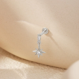 Macro shot of S925 sterling silver heart crown stud earring with sparkling crystals