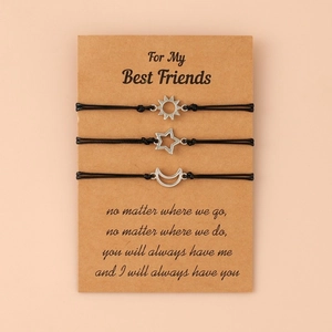 Friendship bracelet set with sun moon and star charms on kraft paper card gift