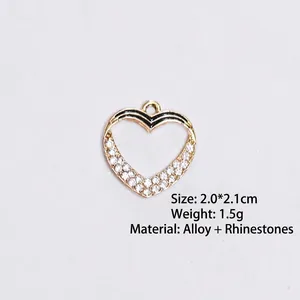 Detail of heart alloy pendant with black enamel trim and inset sparkling rhinestones