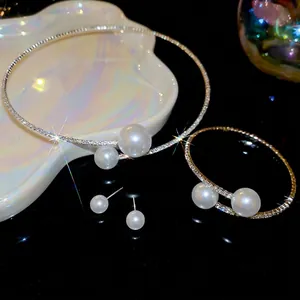 Elegant pearl jewelry set with sparkling rhinestones including necklace cuff and earrings