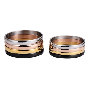 Sleek stackable minimalist bangles in gold, silver, rose gold, and black finishes